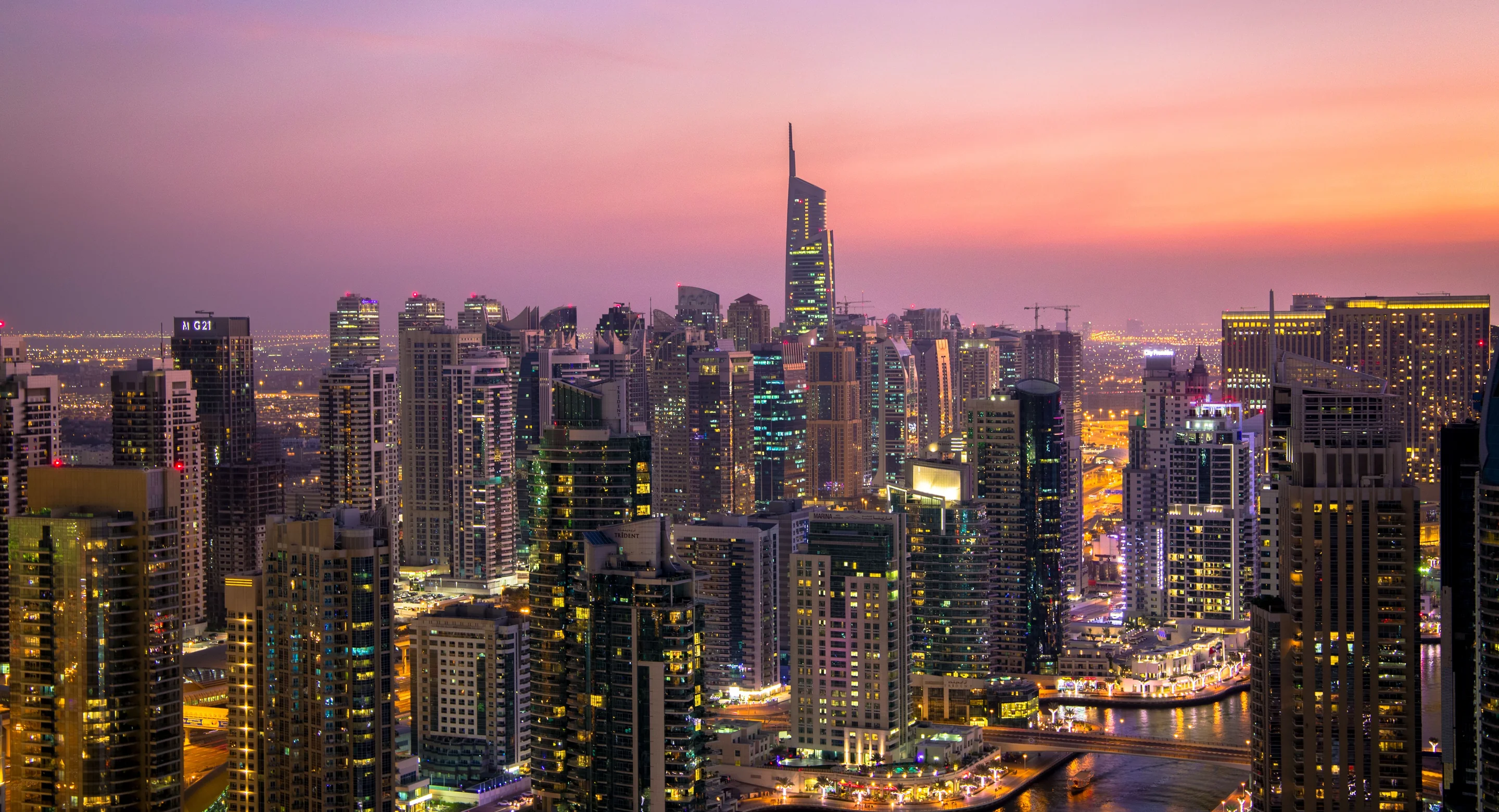 Dubai skyline of glass towers at dusk